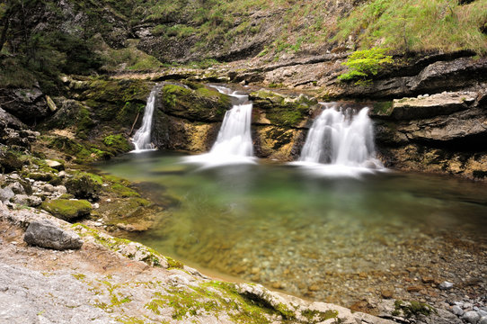 long exposure of three little waterfalls at a mountain creek in Bavarian Alps