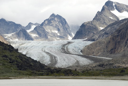 Outlet glacier descending from main ice sheet, along north side of Prins Christian Sund, southern tip of Greenland