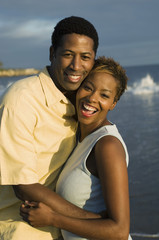 Portrait of an African American couple embracing at beach