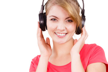 Naklejka premium Woman in big headphones listening music isolated