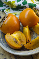 ripe persimmon on a plate
