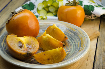 ripe persimmon on a plate