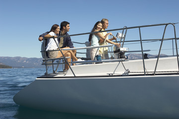 Group of multi ethnic friends travelling on a sailboat