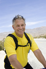 Portrait of a handsome senior man in sportswear smiling