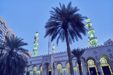 United Arab Emirates, Dubai, Illuminated Grand mosque under blue sky at dusk