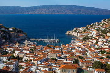 Fototapeta na wymiar Top view on houses and yachts marina at Hydra island, Greece, Aegean sea.