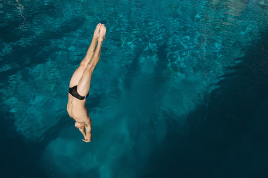 High angle view of a man diving into the pool