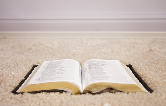 Opened Bible on Carpet.