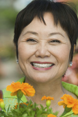 Woman Holding Flowers outdoors portrait close up