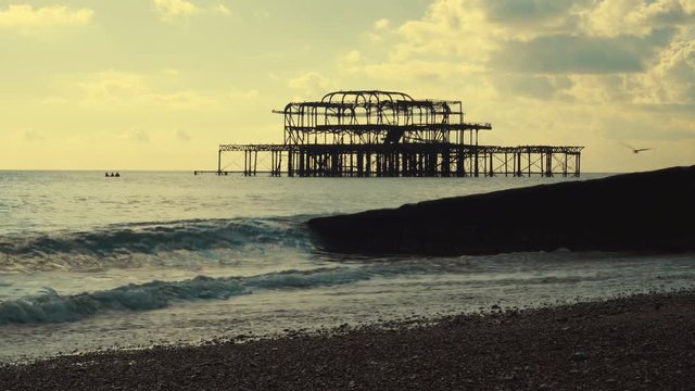 A wide angle view of the West Pier and the coast of Brighton, England, UK. The pier opened in 1866 and closed in 1975  but has become increasingly derelict since closure.
