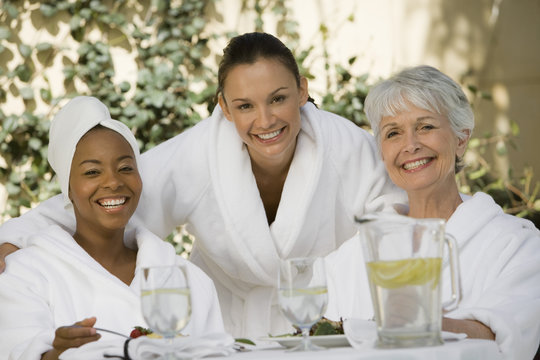 Portrait Of Multi Ethnic Female Friends At Dining Table