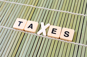 Alphabet TAXES on bamboo rolling mat