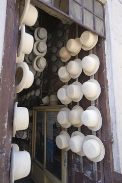 Shop of Alberto Pulla, the famous hatter on Calle Larga, where paja toquilla, misnamed panama hats, are sold and repaired with white sulphur paint, Cuenca, Azuay Province, Southern Highlands, Ecuador