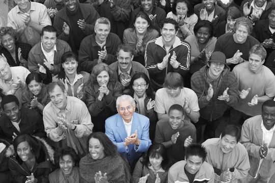 Elevated view of multiethnic group applauding together