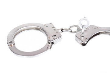Photo of a pair of handcuffs isolated on a white background