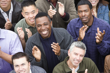 Fototapeta premium High angle view of happy multiethnic people clapping