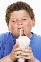 Teenage enjoying the milk shake isolated over white background