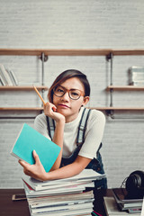 Picture of Asian women were happy to learn from reading