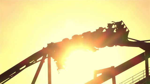SLOW MOTION: Extreme roller coaster ride upside down looping