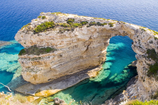 A view of the Trypitos Arch on the south coast of Paxos, Ionian Islands, Greek Islands, Greece