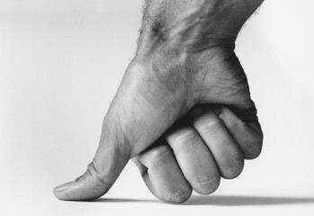 Thumb pressing down (b&w) (close-up)