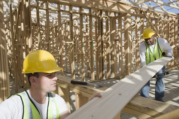 Manual workers working together at construction site