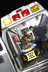 Person receiving medical aid inside ambulance © MDBPIXS