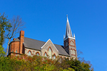 St. Peter's Roman Catholic Church in Harpers Ferry, West Virginia, USA. Church building on the hill at autumn.