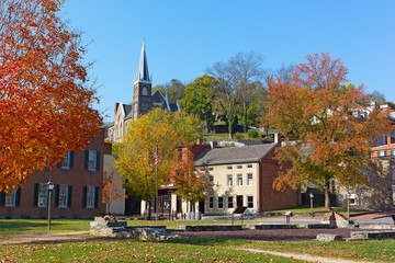 Harpers Ferry historic town in autumn, West Virginia, USA. St. Peter's Catholic Church and historic town buildings.