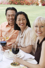 Portrait of three mature friends having fun on vacation together
