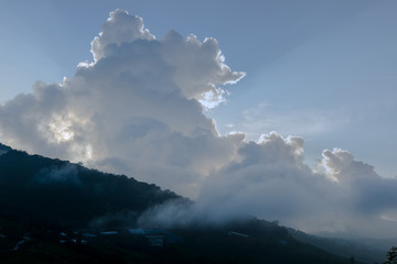 ray of sunshine between the evening clouds