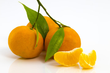 Slices of juicy tangerine isolated on white