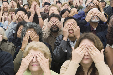High angle view of people covering eyes with hands