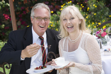 Portrait of a happy Caucasian couple sitting together for a brunch