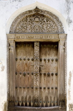 An example of an intricately carved wooden Arab door, Stone Town, Zanzibar, Tanzania