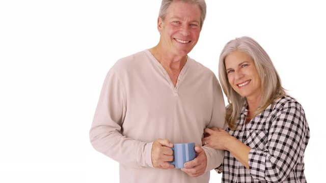 Two happy husband and wife seniors smiling on isolated beackground