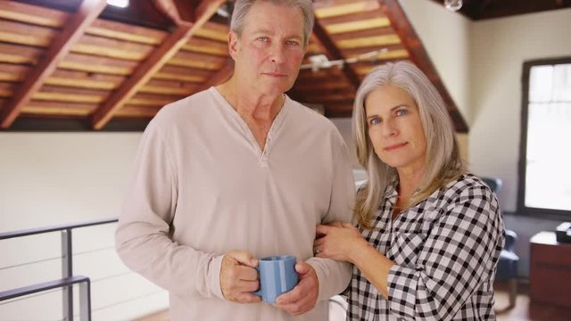 Charming mature white couple looking serious