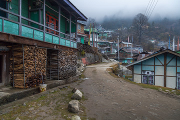 Indian small hillside village town of Lachen, Sikkim on a foggy winter morning.