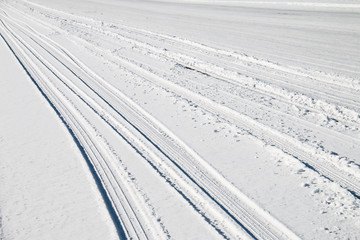 Car tire track in snow