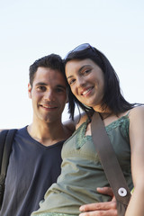 Obraz premium Closeup portrait of romantic young couple standing against clear sky