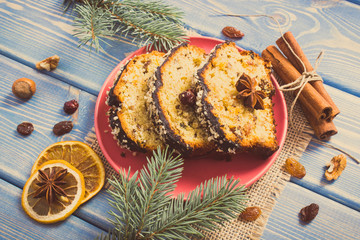 Vintage photo, Fresh baked fruitcake for Christmas on plate and spruce branches on boards