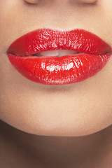 Fototapeta premium Closeup of sensuous woman wearing red lipstick