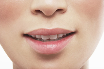 Naklejka premium Closeup of beautiful woman's lips on white background