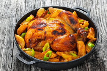 roast chicken with fried potato wedges and leek