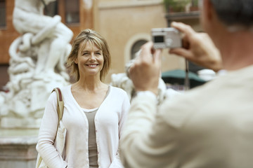 Happy couple looking at each other at outdoor cafe in Rome