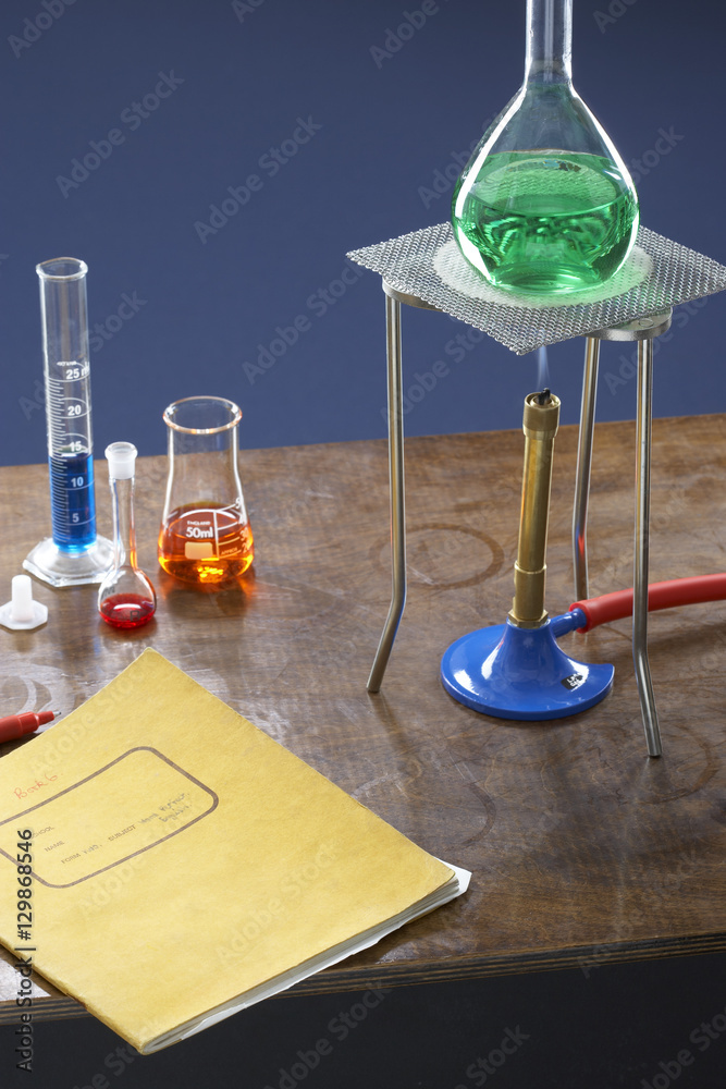 Wall mural bunsen burner tripod flask and test tubes in science laboratory