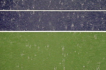 Fototapeta na wymiar heavy rain on tennis court