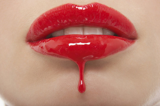 Detail Shop Of Red Lipgloss Dripping From Woman's Lips