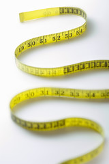 Winding strip of measuring tape close-up