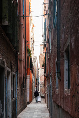 Fototapeta premium narrow street in historic area of Venice city